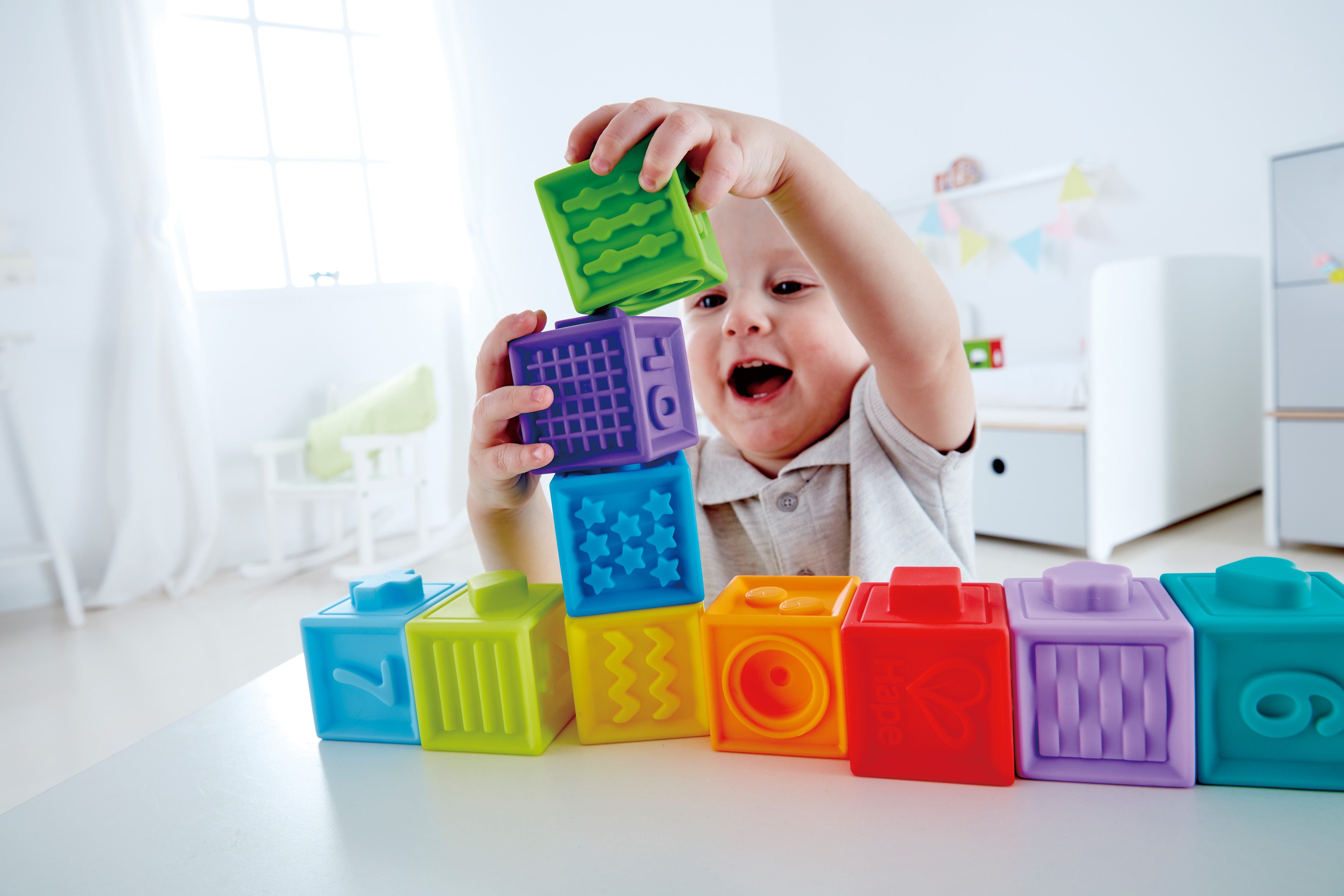 Hape Squeeze Me Blocks Soft Silicone Stacking Toy 10pcs – Colorful Textured Blocks for Teething, Stacking, and Early Learning