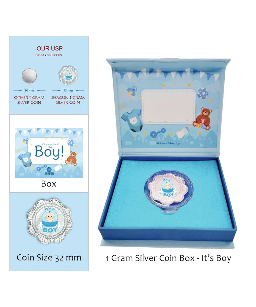 A baby boy silver coin presentation set by Shaguit Coins, featuring a 32mm silver coin with a blue and white bear design, shown inside a blue gift box with a matching inner card. An inset on the left details the coin sizes and packaging options.