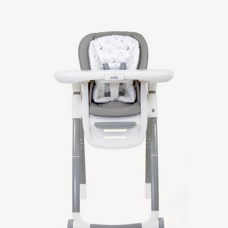 Baby high chair with gray cushion and white base on a white background, featuring a warranty badge.