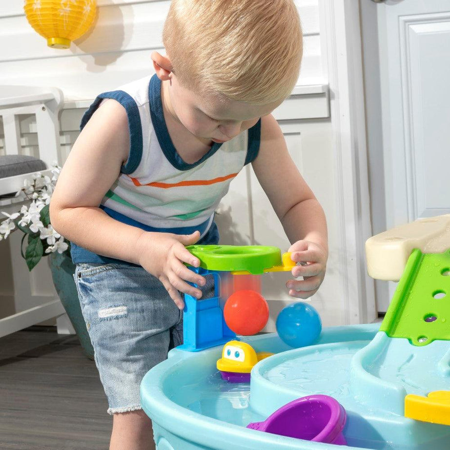 Step2 Ball Buddies Adventure Center Water Table - Two-Tier Water Play Table with Dump Truck, Train, Boat & Helicopter Toys | 22-Piece Accessory Set | For Toddlers 2+ Years | Outdoor Sensory STEM Activity Table