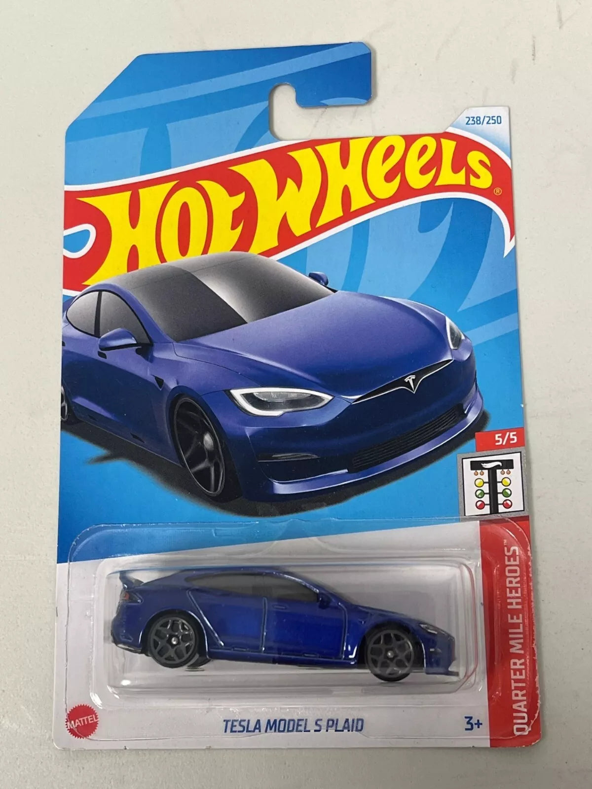 Hot Wheels Tesla Model S Plaid die-cast car in sleek design, featured as part of the Quarter Mile Heroes series (5/5) with collector number 238/250, suitable for ages 3+