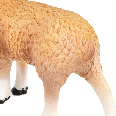 Close-up of a sheep figurine with detailed wool texture on a white background
