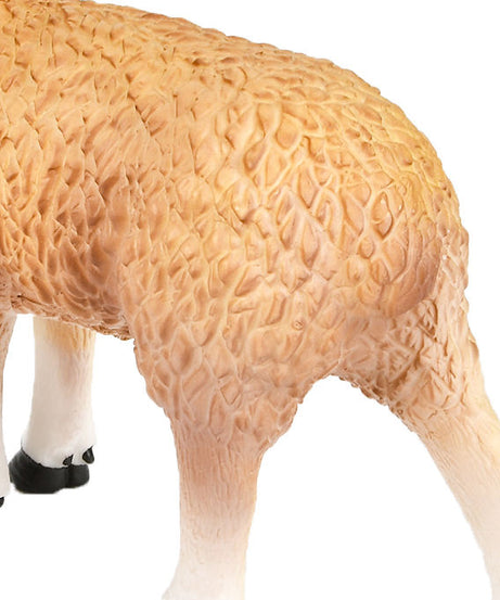 Close-up of a sheep figurine with detailed wool texture on a white background