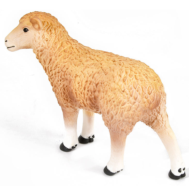 Toy sheep figure on a white background